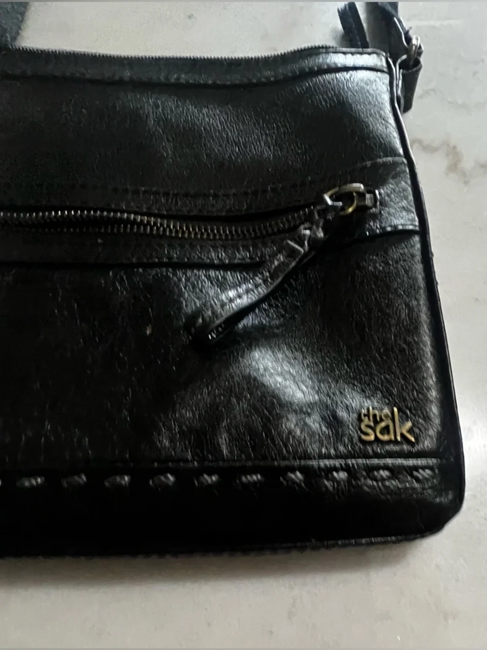 The Sak Black Leather Crossbody Bag with Gold Hardware And Colorful Lining